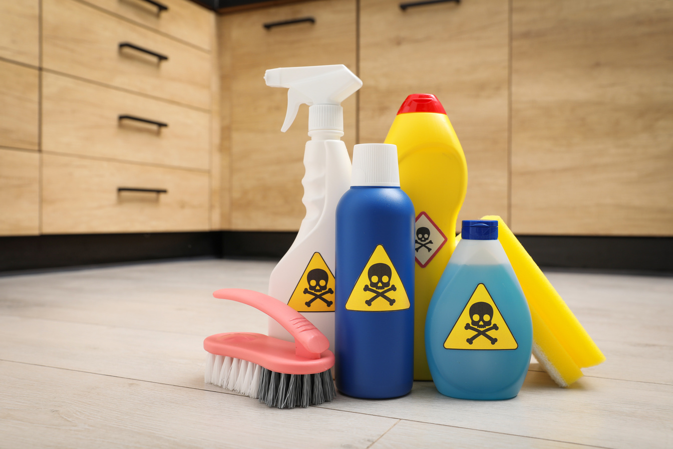 Bottles of Toxic Household Chemicals with Warning Signs, Scourin